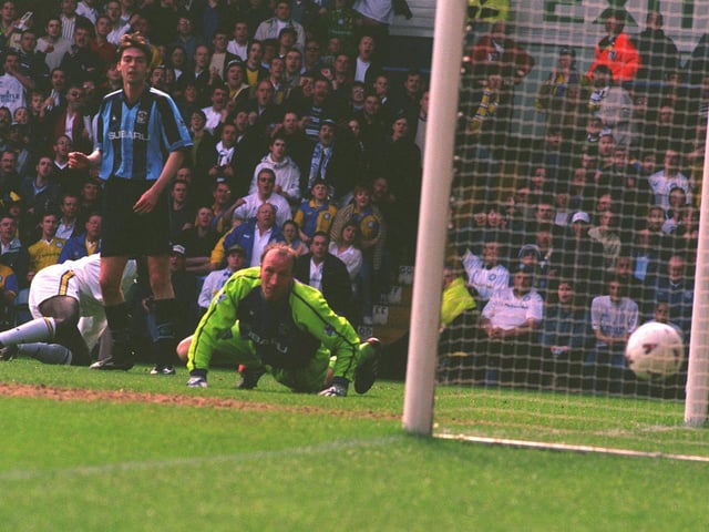 Jimmy Floyd Hasslebaink puts the ball past Coventry City goalkeeper Steve Ogrizovic to score United's first goal.