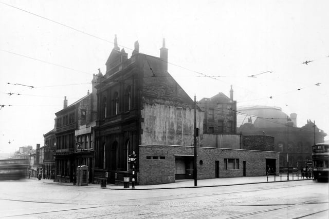 New Market Street and Kirkgate pictured in March 1949. To the left are the Midland Bank and the Regent public house. In 1843 Thomas Sykes and Edward Rayner were sentenced to death after committing homosexual acts in the toilets at The Regent. This was later reduced to life imprisonment.