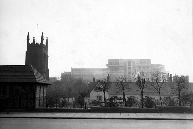 Looking south from Merrion Street across the rest garden towards Lewis's store in March 1948. St John's Church is on the left.