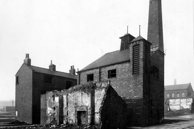 January 1943 and pictured are derelict and partly demolished buildings at the junction with West Street, background right, and Saville Street, foreground right. In the background, right, part of the Park Methodist Chapel is visible off Caroline Street. The chimney faintly seen behind the chapel is from Benjamin Simon & Sons Ltd.