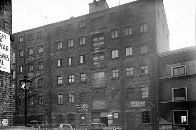 The Calls in January 1949. Pictured is a warehouse, housing 'H. Sender & Co., wholesale clothiers', 'Moorhouse and Brocklesby, leather factors' and 'The Leeds General Clothing Company'.