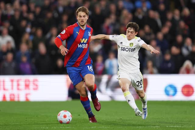 Joachim Andersen of Crystal Palace runs with the ball under pressure from Daniel James. Picture: Julian Finney/Getty Images.