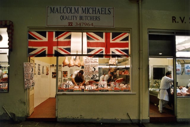 Malcolm Michaels Quality Butchers on row 6 of Kirkgate Market in September 1999. One poster advertises the 'Millenium Mega Pack' consisting of loin chops, mince, sliced lamb, liver, chicken legs, beef steak, sliced pork and three good joints for only £20.