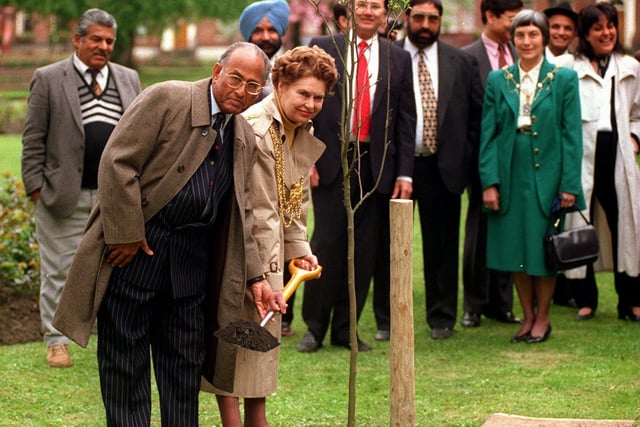 Members of the Yorkshire Indian Society watch as the Lord Mayor of Leeds Coun Peggy White and the Indian High Commissioner Dr Laxmi Singhvi plant an 'Indo-British Friendship Tree' in Park Square.
