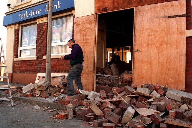 A workman clears the debris at the Yorkshire Bank on York Road after an attempted robbery.