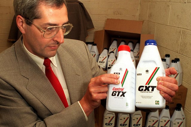 West Yorkshire Trading Standards Service seized fake 500 bottles of fake Castrol GTX motor oil. Pictured is senior principle officer Graham Hebblethwaite with one of fakes alongide the real thing on the left.