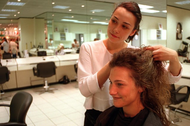 'Something like this, perhaps...' Regis artistic director Lina Bentley tries a bit of hair manipulation on Jeanette Massey in May 1998.