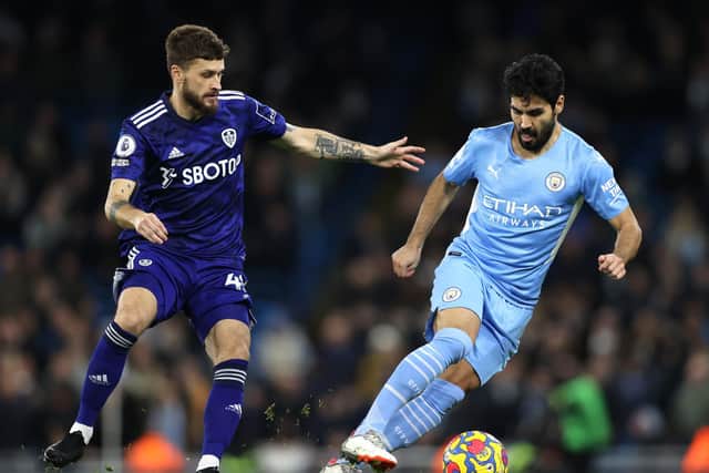İlkay Gündoğan holds off the challenge of Mateusz Klich during Leeds United's 7-0 defeat to Manchester City at the Etihad in December. Pic: Clive Brunskill.