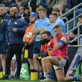 Jamie Jones-Buchanan, third from left, watches the win over Hull KR alongside Rhinos' backroom staff. Picture by Bruce Rollinson.