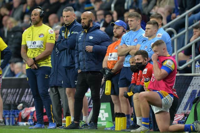 Jamie Jones-Buchanan, third from left, watches the win over Hull KR alongside Rhinos' backroom staff. Picture by Bruce Rollinson.