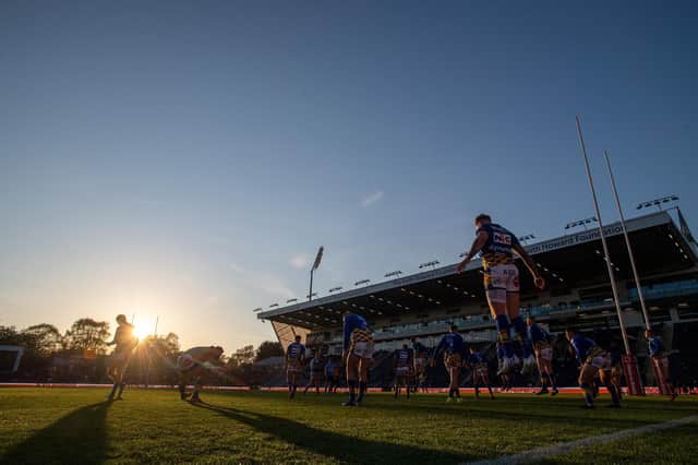 Rhinos warm-up as the sun sets before their win over Hull KR. Picture by Bruce Rollinson.