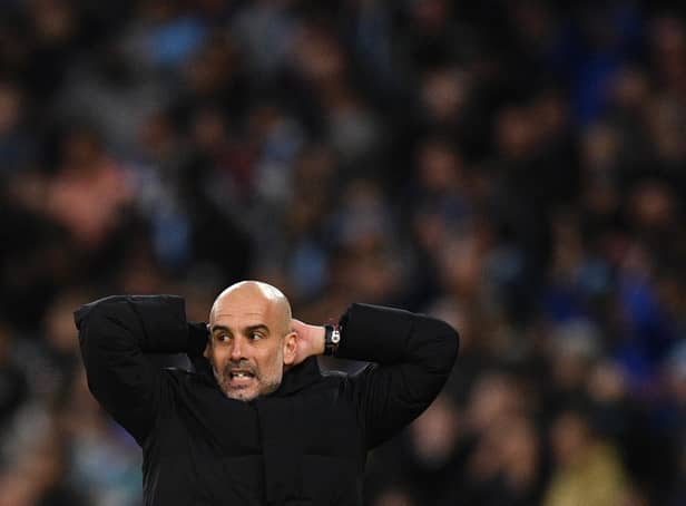 DOUBLE SETBACK: For Manchester City boss Pep Guardiola, above, for Saturday evening's clash against Leeds United at Elland Road.
Photo by OLI SCARFF/AFP via Getty Images.
