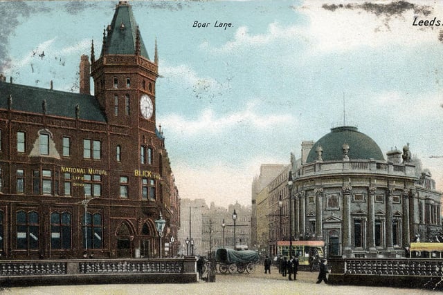 A colour tinted postcard with a post date of April 17, 1903, showing a view towards Boar Lane from City Square.