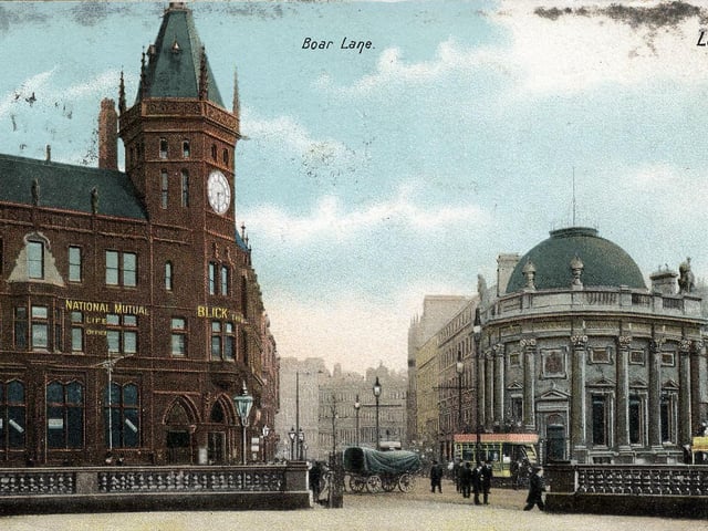 A colour tinted postcard with a post date of April 17, 1903, showing a view towards Boar Lane from City Square.