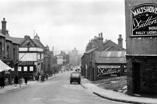 An undated postcard view of Branch Road looking north-east with Armley Road in the distance. On the right is the Malt Shovel Hotel, a Dutton's public house.