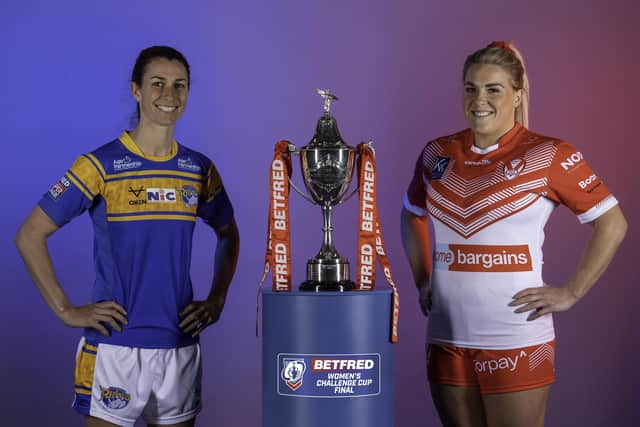 Leeds Rhinos' Courtney Winfield-Hill and St Helens' Amy Hardcastle with the Betfred Women's Challenge Cup ahead of Saturday's final at Elland Road. Picture: Allan McKenzie/SWpix.com