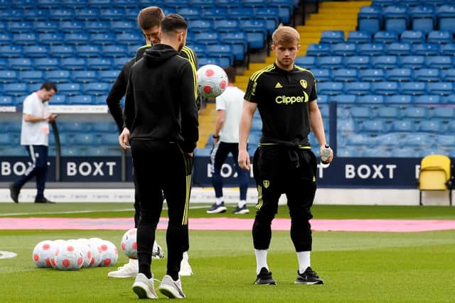 BIG TEST: Leeds United trio Joe Gelhardt, right, Sam Greenwood, middle, and Illan Meslier, left, check out the pitch ahead of Saturday evening's clash against Manchester City at Elland Road. Picture by Simon Hulme.