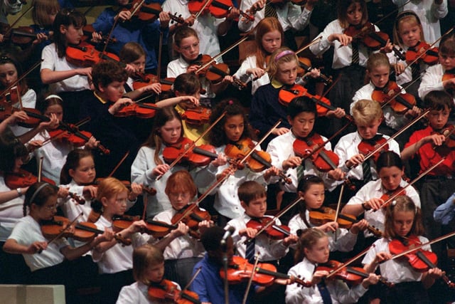 Leeds Schools Music Association held a concert at Leeds Town Hall. Pictured are a group of young violinists playing the Can Can conducted by Susan Derry.
