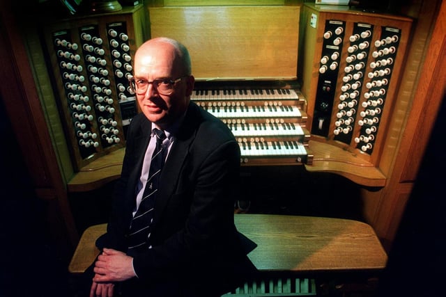 Master of the music for Leeds Parish Church, Simon Lindley, sits with the £150,000 newly-restored organ.