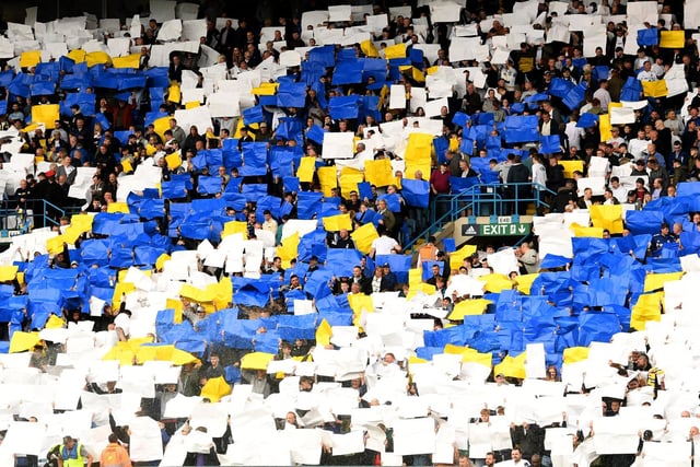Leeds United's fans hold up the paper cards supplied by the club to spell out Yorkshire in the East Stand.