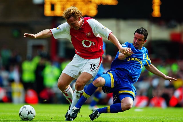 Arsenal's Ray Parlour shields the ball from Gary Kelly.