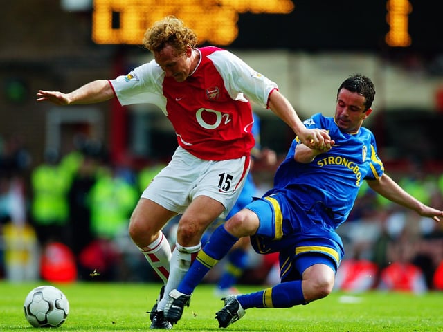 Arsenal's Ray Parlour shields the ball from Gary Kelly.