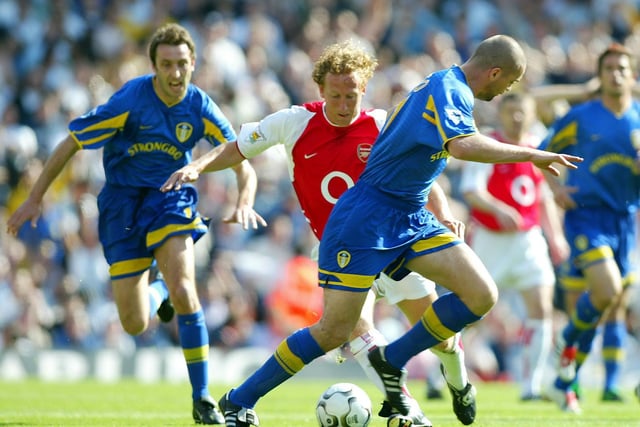 Arsenal's Ray Parlour gets round Dominic Matteo.