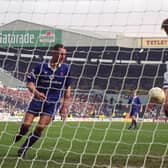 CHAMPIONS-ELECT: Lee Chapman, right, bagged Leeds United's second goal as part of a 3-0 win against a Chelsea side featuring former Whites favourite Vinnie Jones, left, to put the Whites back in pole position back in April 1992. Picture by Varleys.