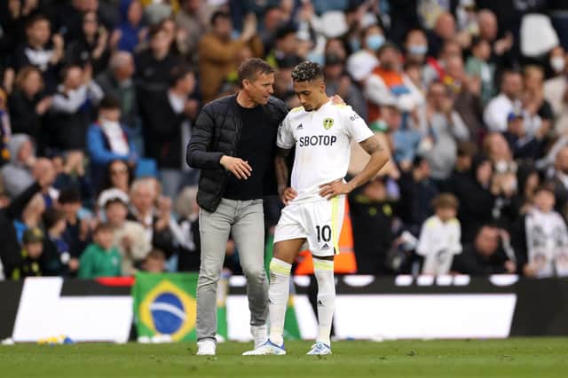 FOUR GAMES LEFT: As Leeds United boss Jesse Marsch, left, talks to Brazilian star winger Raphinha, right, after Saturday's 4-0 loss at home to Manchester City.
Photo by Lewis Storey/Getty Images.
