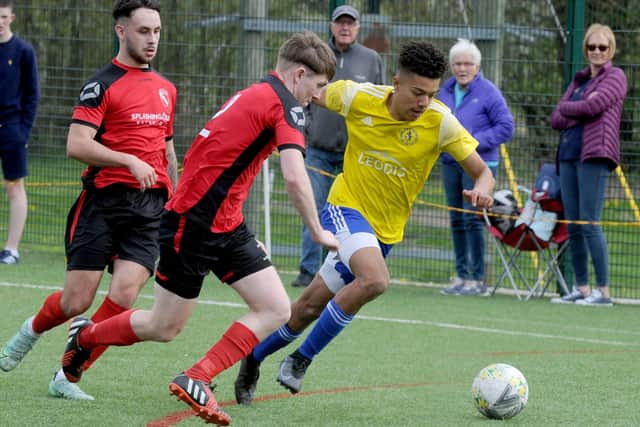 Theo Bailey, of Horsforth St Margarets, takes on Horbury Town's Finlay Ellis during Saturday's West Yorkshire League Premier division clash. Picture: Steve Riding.