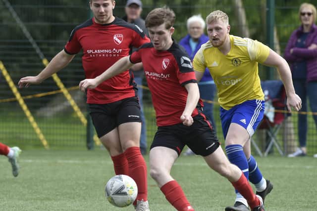 No messing from Horbury Town's Finlay Ellis as he clears the danger from Horsforth St Margarets in the final minutes of Saturday's Premier encounter. Picture: Steve Riding.