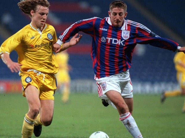 Wesley Boyle hunts down Crystal Palace's Richard Kennedy.