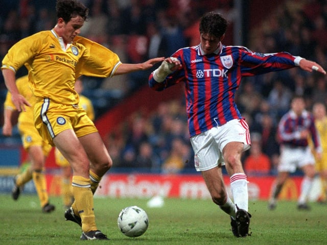 Lee Matthews challenges Crystal Palace's David Woozley.