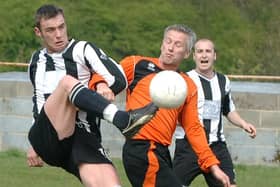 Tingley Athletic's Andrew Weatherhead, centre playing for Howden Clough in 2010, has retired from West Yorkshire League football after 40 years. His last game - as captain - was his current club, Tingley, at his former club, Howden. Picture: Steve Riding.