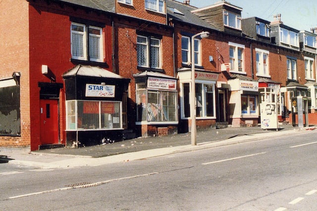 A row of shops and houses on Tempest Road between the junctions with Maud Avenue (left) and Stratford Street. The first shop on the left, Star Sweet Centre, was previously Heslington's baker. Next to this is the Fashion Cloth Store, then Dana Properties and a newsagents.