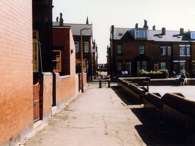 A ginnel running between the back of Maud Avenue and the boundary wall of Cross Flatts School, which crosses Harlech Road then Burlington Road before eventually leading out onto Tempest Road.