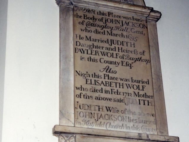 A memorial plaque in St. Mary's Church to John Jackson of Cottingley Hall. The inscription reads: 'Near this Place was buried the Body of John Jackson of Cottingley Hall, Gent, who died March 1695.