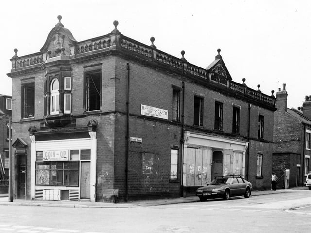 Hardy Street taken from Greenmount Street at the junction with Lodge Lane in July 1984. This is the former premises of a branch of the Leeds Industrial Co-operative Society and in this image is undergoing conversion to the Kashmir Muslim Welfare Centre.