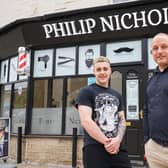 Jimmy Wegg, barber and Phil Townend, owner and barber, outside the rebuilt and refurbished Philip Nicholas barber shop in Stanningley