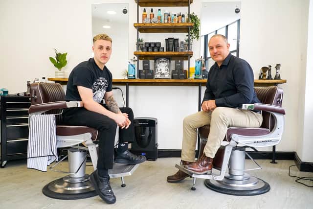Jimmy Wegg, barber and Phil Townend, owner and barber, inside the rebuilt and refurbished Philip Nicholas barber shop in Stanningley