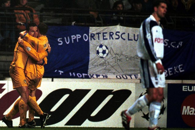 Mark Viduka celebrates scoring with teammate Alan Smith during Leeds United's Champions League Group D clash against Anderlecht at the Stade Vanden Stock in February 2001.