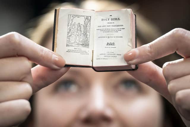 Rhian Isaac, special collections senior librarian at Leeds City Library, holds a 1911 tiny Bible which was rediscovered at Leeds City Library during the Covid lockdowns.  PIC: Danny Lawson/PA