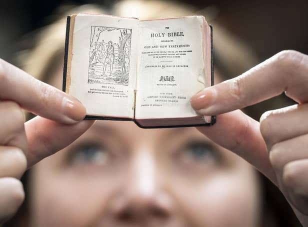 Rhian Isaac, special collections senior librarian at Leeds City Library, holds a 1911 tiny Bible which was rediscovered at Leeds City Library during the Covid lockdowns.  PIC: Danny Lawson/PA