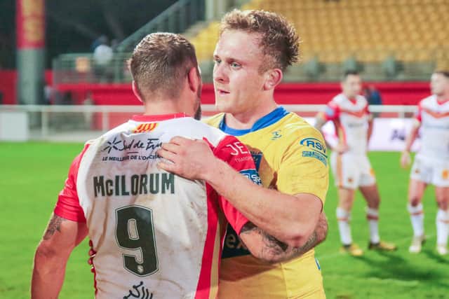 Jez Litten embraces Michael McIlorum after Hull KR's defeat to Catalans. (Picture: SWPix.com)