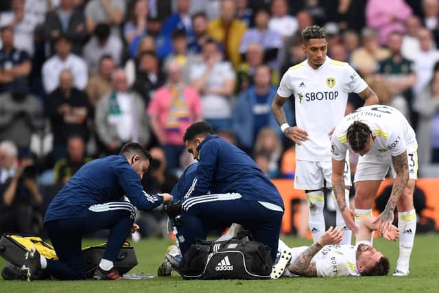 ROCKED: Leeds United's Stuart Dallas suffers a femoral fracture during the Elland Road fixture with Manchester City (Photo by OLI SCARFF/AFP via Getty Images)