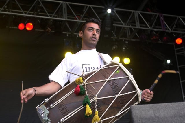 Thousands turned out to enjoy the Leeds Mela in Roundhay Park. Pictured is a drummer performing with Bally and Jussi from B21 on the festival stage.