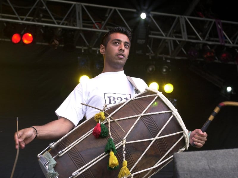 Thousands turned out to enjoy the Leeds Mela in Roundhay Park. Pictured is a drummer performing with Bally and Jussi from B21 on the festival stage.