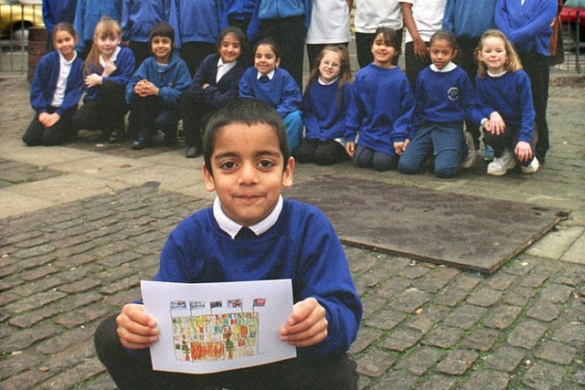 Pupils at Rosebank Primary School in Burley provided the design for the Queens Hotel's Christmas card which is being held by Rishi Limbechaya.