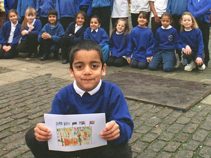 Pupils at Rosebank Primary School provided the design for the Queens Hotel's Christmas card which is being held by Rishi Limbechaya.