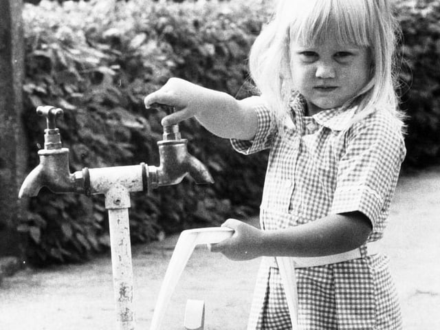 Julie Greensmith at a standpipe test outside her home on Fir Tree Green at Moortown during the drought of 1976.